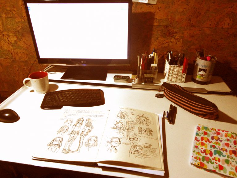 Andrea uses her computer to add screentones. Andrea uses her computer to add screentones.