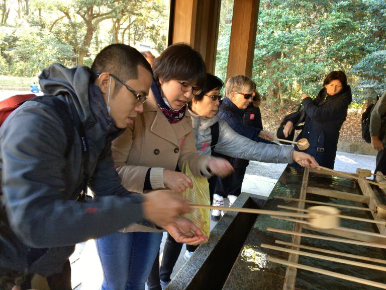 Jeet leans how to purify himself before entering Meji Shrine.
